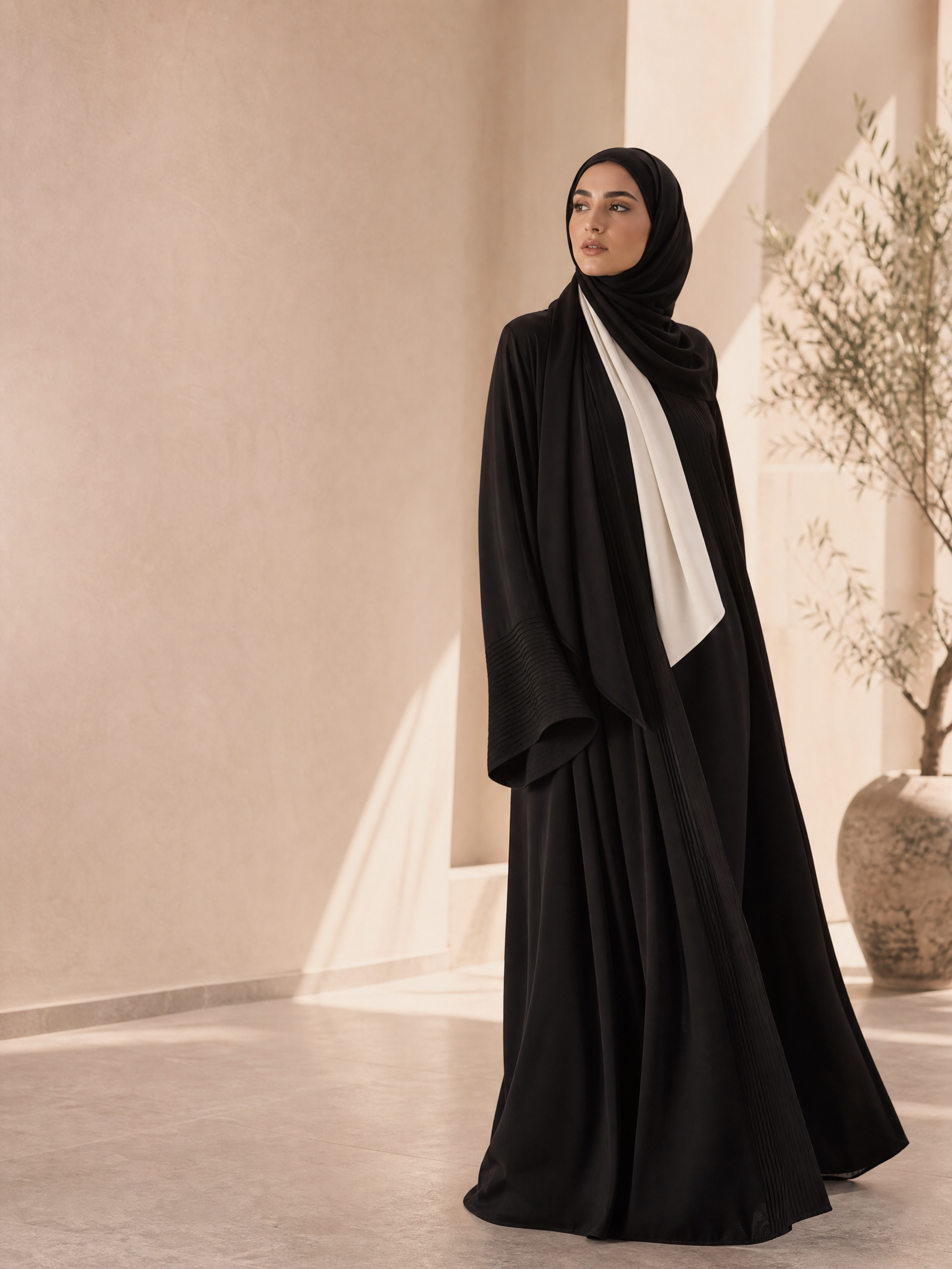 Woman wearing a Katherpencil black abaya